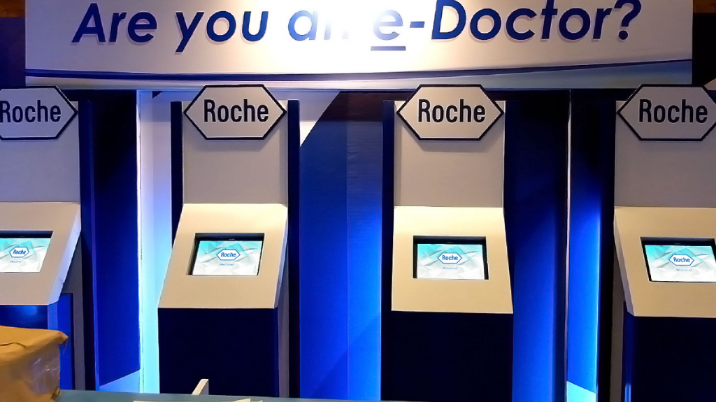 The Hand Creative Roche Touchscreen Quiz and Slot Machine